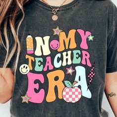 a woman wearing a t - shirt that says,'no my teacher era '