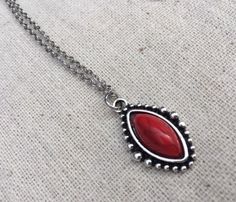 "Simple, chic and versatile! Here is a red stone necklace that is set in a perfectly detailed silver frame. The perfect everyday necklace! Made from allergy free plated silver. The pendant measures 1\" long by 1/2\" wide. It hangs from a shiny strong 18\" stainless steel necklace chain with a lobster clasp. I have matching earrings in my shop if you would like the whole set. Here is the link https://etsy.me/2R5NsWx I have this same style pendant necklace available in other color ways as well! He Red Southwestern Sterling Silver Necklace, Red Bohemian Sterling Silver Necklace, Red Southwestern Style Jewelry Gift, Southwestern Style Red Jewelry For Gift, Southwestern Style Red Jewelry For Gifts, Nickel-free Southwestern Style Necklace As Gift, Red Southwestern Turquoise Necklace For Gift, Southwestern Style Nickel-free Necklace For Gift, Southwestern Style Red Necklace For Gift