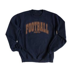 Looking for a cute versatile top to wear this summer? Make sure to grab one of our Varsity Football Vibes Sweatshirts! This soft and comfortable shirt is the perfect top for any outfit. It can be paired with biker shorts, Jeans, or the classic stay at home sweats! The bright color adds a pop of summer to any outfit. This sweatshirt is true-to-size, so be sure to order your regular size! If you are looking for a more oversized look, make sure to size up. Text Print Tops For Game Day In Fall, Comfortable Cotton Tops For College, College Style Crew Neck Tops For Sports Season, Navy Letter Print Tops For Fall, Relaxed Fit Tops With Text Print For Sports Season, Varsity Style Relaxed Fit Top For Fall, Navy Varsity Top For Fall, Fall Sports Tops With Text Print, Fall Sports Top With Text Print