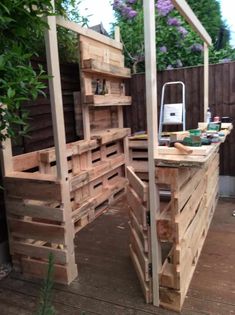 an outdoor kitchen made out of wooden pallets