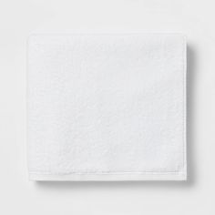 a white towel folded on top of a table