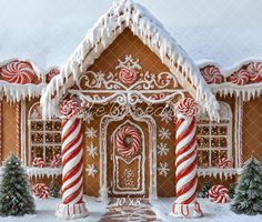 a gingerbread house decorated for christmas with candy canes