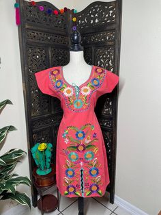 "Beautiful floral embroidered dress! This has been made and brought directly from Chiapas, Mexico. This dress is 100% handcrafted. Beautiful and clean work! Very light weight and fresh looking. DETAILS: Dress size: Small Measurements: 36\" (shoulder to hem) 21\" (underarm to underarm) Dress size: Large Measurements: 40\" (shoulder to hem) 24\" (underarm to underarm) Dress size: XLarge Measurements: 40\" (shoulder to hem) 23.5\" (underarm to underarm) CARE DETAILS: Hand wash only Delicate care Ha Traditional Spring Dress With Embroidered Neckline, Traditional Spring Embroidered Dress, Cotton Embroidered Dress With Floral Embroidery For Fiesta, Traditional Short Sleeve Spring Dresses, Traditional Spring Embroidered Dress With Machine Embroidery, Traditional Short Sleeve Dresses For Spring, Traditional Dress With Multicolor Floral Embroidery, Spring Dresses With Multicolor Embroidery, Traditional Short Sleeve Embroidered Dress For Spring