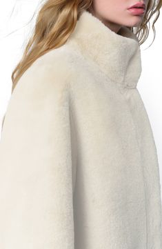 This clean and minimalist coat cut in a fingertip length is fashioned from the brand's signature Pluche faux fur for luxurious, everyday glamour. 37" length (size Medium) Hidden-snap placket Stand collar Front slit pockets 100% recycled polyester Dry clean Imported White Faux Fur Coat, Fur Design, Fall Outerwear, Fitted Coat, Planet People, White Faux Fur, Kids Outerwear, Designer Clothes For Men, Modern Outfits