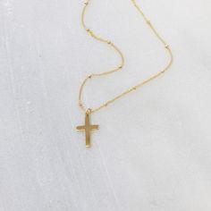 "Dainty Cross Necklace & Gift for Her This dainty cross necklace is perfect for yourself or as a meaningful, special gift. Designed dainty for everyday wear in high quality 14kt gold filled or sterling silver to last over time! DETAILS -Dainty cross charm 12 mm -Charms and chain are 14kt gold filled or sterling silver- not plated -Your choice of chain style. LENGTH -Please select from the drop down selection. -The standard length is normally 18\". -Model is wearing a 16\" in Photos. ∙ EXTRA Minimalist Cross Pendant Necklaces For Baptism, Dainty Adjustable Cross Necklace, Minimalist Cross Pendant Necklace For Baptism, Minimalist Cross Pendant Necklace For First Communion, Dainty Cross Pendant Necklace For Baptism, Dainty Cross Necklace For First Communion, Dainty Cross Necklace For Baptism, Personalized Dainty Cross Necklace, Spiritual Cross Pendant Necklace For First Communion