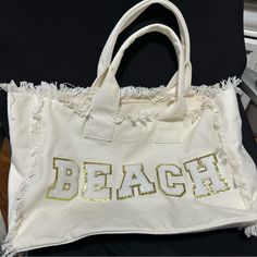 White Tote With “Beach” Glitter Letters Brand New (Without Tag) Purchased From Kenz Kustom Trendy White Beach Bag For Vacation, Trendy Cotton Beach Bag For Beach Season, Trendy Cotton Beach Bag, Trendy Sand-colored Bag For Beach Season, Trendy Beach Bag For Beach Season, Trendy Beach Bag For Beach Season Day Out, Trendy Beach Bag For Day Out, White Beachy Beach Bag For Day Out, Trendy Sand Color Beach Bags