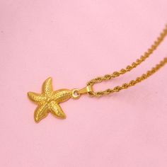 Shine Bright with the Gold Starfish Charm Necklace Are you a passionate lover of the sea and all its wonders? Then our Gold Starfish Charm Necklace is the perfect accessory to showcase your adoration for the deep blue. This exquisite necklace is carefully crafted to capture the essence of the sea, making it a must-have for any sea enthusiast. As part of our Starfish Necklace Collection, the Gold Starfish Charm Necklace is a timeless piece that will instantly elevate your style. Its intricate des Gold Starfish Clavicle Chain Necklace, Ocean-inspired Jewelry With Starfish Charm As Gift, Ocean-inspired Jewelry With Starfish Charm For Gift, Ocean-inspired Necklaces With Star Charm, Ocean-inspired Jewelry With Star Charm, Ocean-inspired Jewelry With Star Charm As Gift, Ocean-inspired Star Charm Jewelry Gift, Ocean-inspired Star Necklaces For Gifts, Ocean Color Necklace With Starfish Charm For Gift