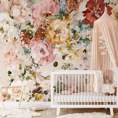 a baby's room with floral wallpaper and a crib in the foreground