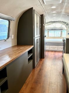 the inside of an rv with wood flooring