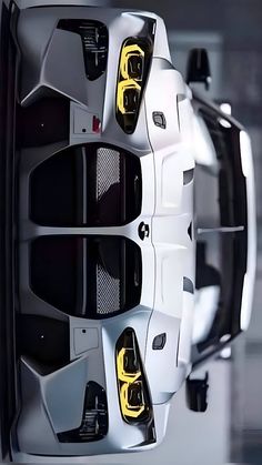 the rear end of a white sports car