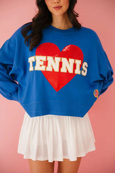 Serve up some style with our Tennis Love Royal Pullover! This oversized cropped pullover features a bold red heart patch and playful USA themed tennis racket patch. Perfect for a day on the court or a casual outing, show off your love for tennis with the white glam Tennis letters. Game, set, match! Preppy Sports Outfits, Bold Clothes, Tennis Love, Judith March, Heart Patch, Date Outfit Casual, Beach Tennis, Heart Patches, Red Pullover