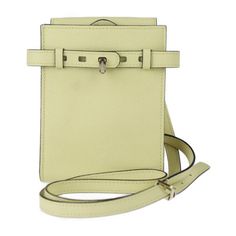 a small white purse with a strap around it's neck and an adjustable clasp on the front