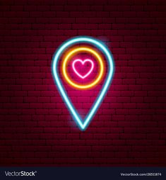 a neon map pointer with a heart in the middle on a red brick wall background