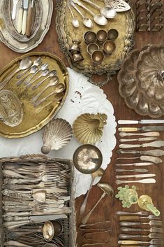 an assortment of antique silverware on display