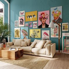 a living room with blue walls and pictures on the wall, including a beige couch