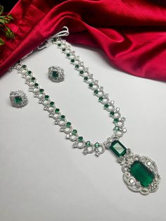 Gorgeous fine quality glass stone studded in white gold rhodium plating with CZ high quality stones Comes with matching earrings. Highest quality and craftsmanship Necklace Fitting is adjustable comes with silver plated back metal chain Earrings Closure: Pushback Necklace Closure: Hook Emerald Green Jewelry, Nita Ambani, Necklace Closure, Indian Bridal Jewellery, Jewellery Wedding, Green Jewelry, Stone Studs, Jewelry Diamond, Bridal Jewellery