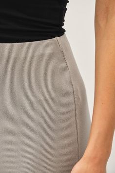 Indulge in luxury with the Be Cool Jersey Knit Maxi Long Pencil Skirt. This ladies skirt features a high rise and a fitted silhouette for a sophisticated look. The ribbed knit fabric and elastic waistband provide comfort while maintaining a lightweight and stretchy feel. Perfect for any casual occasion. Elegant Ribbed Stretch Bottoms, Knee-length Ribbed Fitted Bottoms, Elegant Stretch Ribbed Skirt, Knee-length Ribbed Stretch Bottoms, Elegant Ribbed Stretch Skirt, Long Pencil Skirt, Be Cool, Fitted Silhouette, Gray Skirt