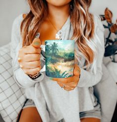 a woman holding a coffee mug in her hands