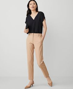 Elevate your wardrobe with the sophisticated charm of Ann Taylor's The Eva Ankle Pant. Perfectly tailored to flatter, these pants feature a slim leg that gracefully crops at the ankle, enhancing your silhouette with its sleek proportions. 

- Size: 10
- Color: Cappuccino Tan
- Material: 92% Cotton, 8% Spandex
- Gender: Female
- Fit: Tailored and fitted
- Rise: Mid-rise, sits 2 1/4" below natural waist
- Length: Hits at ankle, 27" inseam with a 14 1/2" leg opening
- Closure: Front zip with hook-a Lean Legs, Knitted Suit, Tan Woman, Womens Dress Pants, Slim Leg, Ankle Pants, Slim Legs, Waist Length, Polished Look