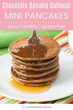 stack of chocolate banana oatmeal pancakes on a plate with syrup being drizzled over them