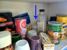 the contents of a kitchen cupboard are labeled with blue arrow pointing to the left side