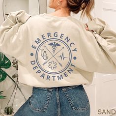 This Emergency Department Sweatshirt / ER Sweater is perfect for work or anytime! Makes a great gift - Cozy and Warm too!   **FRONT & BACK PRINT**  **UNISEX SIZING**  See more Emergency Department designs here: https://etsy.me/3VsWA9T ♥ W E L C O M E  T O  S K E T C H Y  C A T  D E S I G N S ! ♥ Click here to return to our shop's home page ⇒ https://www.etsy.com/shop/SketchyCatDesigns Say hello to your new favorite sweatshirt! All products are printed with eco-friendly water-based inks, giving t Emergency Department Design, Fun Shirts, Er Nurse, Emergency Medicine, Emergency Department, S K, Cricut Ideas, 50 50, Say Hello