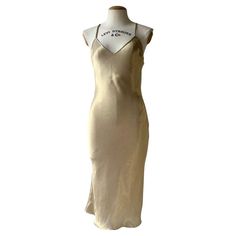 Check out this item from 1stdibs! Gold Christian Dior by John Galliano 2002 dress: https://www.1stdibs.com/id-v_22701512 1stdibs John Galliano, Silk Party Midi Dress With Adjustable Straps, Silk Midi Dress With Adjustable Straps For Party, Silk Midi Dress With Spaghetti Straps And Satin Finish, Elegant Gold V-neck Slip Dress, Silk V-neck Slip Dress For Evening, Sleeveless Satin Finish Day Dress, Silk Midi Dress With Spaghetti Straps For Cocktail, Sleeveless Satin Finish Dress For Daywear