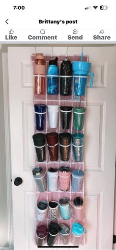 a wall mounted cup holder filled with cups