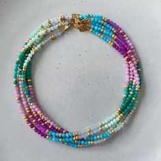 This necklace is strung in a mix of pink, green and blue semi-precious stones. One of our favorites because this necklace is a perfect match with other necklaces.





 Size: approx. 43 cm

 Material: Jade, agate and 18k gold plated clasp with E-coating Bohemian Jade Necklace With Colorful Beads, Colorful Beaded Jade Bracelet, Multicolor Jade Beaded Jewelry, Multicolor Beaded Jade Necklace, Hand-strung Turquoise Jade Beaded Necklaces, Summer Necklace, Arm Band, Perfect Match, Semiprecious Stones