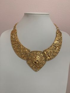 This is a unique piece of jewelry signed BARRERA for Avon (Jose Maria BARRERA), three section bib runway statement necklace! Gold tone, hinged, hook closure,  A beautiful collector's item and conversation piece. This necklace is perfect for any occasion. Necklace length: approx. 17" (adjustable) Excellent condition, like new! It comes from a private collection. PLEASE look at ALL pictures for measurements and condition as they are a very important part of the description, and what you will receive! Pictures are made with different light! Please note that this is sold "As Is", no returns please! The Link to my shop is: https://www.etsy.com/shop/MyWildWork Antique Gold Choker Jewelry, Gold Bib Necklace Costume Jewelry, Gold Costume Jewelry Bib Necklace, Gold Bib Choker Costume Jewelry, Gold Choker Bib Necklace As Costume Jewelry, Vintage Gold Bib Necklace Gift, Gold Vintage Bib Necklaces For Gifts, Vintage Gold Choker With Intricate Design, Gold Metal Bib Necklace