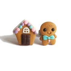 two small gingerbread houses with candy on them