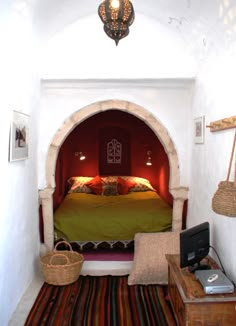 a bed sitting inside of a bedroom on top of a rug