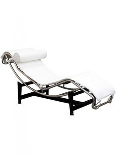 a white chaise lounge chair sitting on top of a metal frame with a roll of paper attached to it