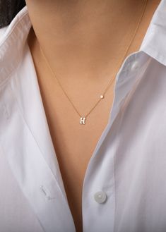 Beautifully handcrafted 14k solid gold initial and a small bezel diamond on a dainty cable link chain necklace. Available in 14k white and yellow gold, this stunning piece will be you new favorite necklace! Wear it with your initial or your loved one's. Size of Initial: Approx. 5mm Diamond Carat Weight: Approx. 0.03 ctw Diamond Clarity: VS Standard Production: 4-9 business days Rush Order Production: 2-5 business days Shipping: Select shipping method at checkout.2-Day Shipping and Overnight ship Solid Gold Initial Necklace, Initial Necklace With Diamond, Necklace With Letter Initial, H Necklace Initial, Dainty Initial Necklace Gold, Initial Necklace Aesthetic, H Initial Necklace, Couple Ring Design, Neck Pieces Jewelry