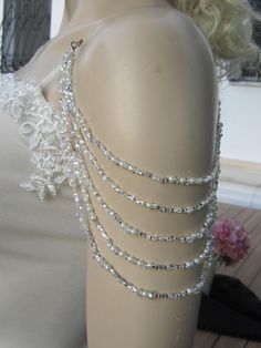 Handmade item Shoulder Necklace Bridal shoulder necklace 2 pieces per order. handcrafted Crystal Detachable Strap made to order Please get in touch for more information. Thank you so much for choosing my store. It is very importent to let my customers happy, so dont hesitate to contact me for your questions. Standart shipping I ship from Turkey , General delivery durations are USA : 12 /20 days Canada : 10/20days Australia: 15/25 days Elegant Beaded Body Jewelry For Wedding, Elegant Beaded Wedding Backdrop Necklace, Beaded Silver Body Jewelry For Wedding, Wedding Pearl Body Jewelry In Silver, Wedding Silver Pearl Body Jewelry, Silver Pearl Body Jewelry For Wedding, Silver Bridal Necklace With Silver Beads For Wedding, Wedding Dress Straps, Rhinestone Wedding Dress