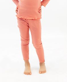 Meet our rib knit leggings in coral pink. It fits snug but has the perfect amount of stretch and softness for your child to explore, play, and adventure comfortably all day. Pair this with our Ruffled Rib Knit Long Sleeve Top - Coral Pink for the perfect outfit! Knit Leggings, Knit Long Sleeve, Long Sleeve Knit Tops, Coral Pink, Perfect Outfit, Long Sleeve Top, Rib Knit, Capri Pants, Long Sleeve Tops