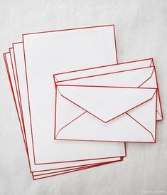 four envelopes lined up on top of each other with red lines coming out of them