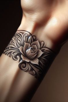 a woman's arm with a flower tattoo on it