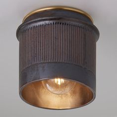 a close up of a light fixture on a ceiling