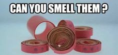 several rolls of pink tape with the words can you smell them?