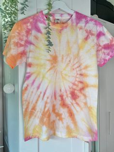 High Quality Handmade Adult and Children's Tie-dye T-shirt's - 100% Cotton! At Tie-dye by Rhi we have a wide variety of colours and sizes available, with each order being handmade to the highest quality. We can customise orders with multiple colours by clicking the 'Custom order' (£20.00) option and leaving your design requirements and size in the personalisation box. FREE standard delivery or upgrade to express delivery! With the quickest turn around possible we will get packaging your order as Pink Hand Dyed Cotton Top, Summer Tie Dye Soft-washed T-shirt, Summer Acid Wash Hand Dyed T-shirt, Hand Dyed Pink Short Sleeve Tops, Casual Pink Hand-dyed T-shirt, Pink Hand Dyed Short Sleeve Tops, Hand Dyed Cotton T-shirt For Summer, Hand Dyed Pink Cotton T-shirt, Summer Crew Neck T-shirt With Natural Dye