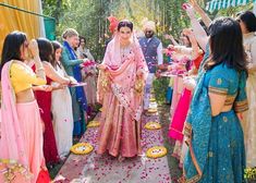 a bride and groom walking down the aisle after their wedding ceremony at an outdoor venue