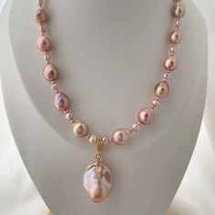 Explore the gentle hues of our Pink to Purple Large Baroque Pearl Necklace. This exquisite piece features stunning freshwater pearls, showcasing a mesmerizing transition from soft pink to elegant purple. Each large Baroque pearl is unique, making your necklace a one-of-a-kind treasure. Perfect for adding a touch of soft color and sophistication to any outfit. Handmade Drop Pearl Necklace, Pink Pearl Drop Pendant Necklace, Pink Baroque Pearl Necklaces For Wedding, Pink Baroque Pearl Necklace For Wedding, Wedding Pink Baroque Pearl Necklaces, Formal Pink Baroque Pearl Jewelry, Wedding Pink Baroque Pearl Necklace, High Luster Pearl Pendant Necklace, Single Strand Pearl Pendant Necklace For Jewelry Making