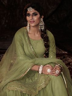 Buy adorable parrot green net embroidered sharara-style-suit online for upcoming grand events and festive season. This graceful set comprises a net sharara with matching net dupatta and net bottom. Western Kurtis, Dupatta Embroidery, Embroidered Sharara, Parrot Green, Pakistani Suit, Salwar Kameez Online, Sharara Suit, Green Bottom, Work Culture