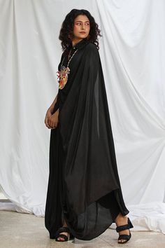 Black relaxed shirt with drape detailing in the front. Paired with a solid draped dhoti and a neckpiece. - Aza Fashions Traditional Blouse With Draped Sleeves In Georgette, Traditional Georgette Blouse With Draped Sleeves, Traditional Drape Black Blouse Piece For Navratri, Silk Sets With Draped Sleeves In Traditional Drape, Traditional Eid Pre-draped Saree With Cape Sleeves, Designer Wear Dabka Saree Traditional Drape, Anarkali Blouse Piece With Sheer Dupatta And Draped Shape, Anarkali Blouse Piece With Sheer Dupatta, Designer Wear Black Pre-draped Saree For Eid