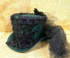 Bottle green front corseted Satin top hat with jewelspearls | Etsy Fitted High Crown Costume Hats For Themed Events, Fitted High Crown Hats For Themed Events, Fitted Gothic Costume Accessories For Themed Events, Fitted Gothic Costume Hats And Headpieces For Themed Events, Fitted High Crown Costume Hats And Headpieces, Gothic High Crown Costume Accessories For Themed Events, Gothic High Crown Top Hat For Themed Events, Fitted Gothic Costume Hats For Themed Events, Victorian Style Fitted Costume Hats