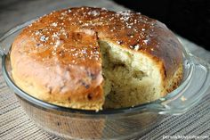 a loaf of bread in a glass dish