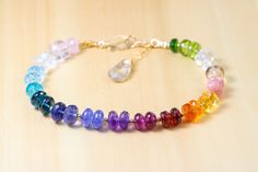 THE JEWELRY IS SHIPPED via DHL EXPRESS (2-5 days delivery door to door). THE DHL SHIPPING COST IS INCLUDED IN THE PRICE. The Rainbow Dream Bracelet - Rainbow Precious Gemstone Bracelet in Gold Filled, Chakra Gemstone Bracelet ► Measurements / Details: - Length including clasp: Made to order (the bracelet in the photo is 7.85 inches/ 20 cm) - Clasp: Secure Artisan Clasp (possible to change to a regular 9mm Lobster Clasp, just please leave a note during the checkout or write me) - Gold: High quali Stone Bracelet Gold, Precious Stones Bracelet, Bracelet Measurements, Multi Gemstone Bracelet, Gold Beaded Necklace, Dream Bracelet, Pink Garnet, Rainbow Palette, Bracelet Rainbow