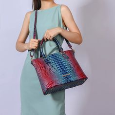 Introducing our exquisite Frankie Satchel Bag, a fusion of bold style and practical design. This Satchel is crafted from luxurious faux gradient rainbow crocodile-embossed material, offering a vibrant and unique texture that adds a striking touch to any ensemble. The bag features a secure top zipper closure, ensuring your belongings stay safe and easily accessible. Inside, you will find a thoughtfully organized space with two slip pockets ideal for your phone and small accessories and a wall zip Formal Multicolor Shoulder Bag With Removable Pouch, Multicolor Tote Shoulder Bag For Formal Occasions, Elegant Multicolor Bag With Adjustable Strap, Multicolor Formal Shoulder Bag With Handles, Luxury Multicolor Handheld Shoulder Bag, Elegant Multicolor Shoulder Bag With Adjustable Strap, Elegant Multicolor Shoulder Bag With Double Handle, Elegant Multicolor Double Handle Shoulder Bag, Luxury Multicolor Shoulder Bag With Top Carry Handle