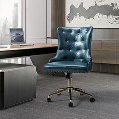 a blue leather office chair sitting in front of a desk with a laptop on it